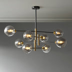 Eight-head Clérachic chandelier with smoky grey globes, lit and hung from a black rod below a pale ceiling.