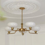 Clérachic five-head copper chandelier with white opal globes, mounted on an ornate plaster ceiling rose.