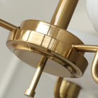 Detail of the Clérachic copper centre hub where the arms meet, with the small finial below.