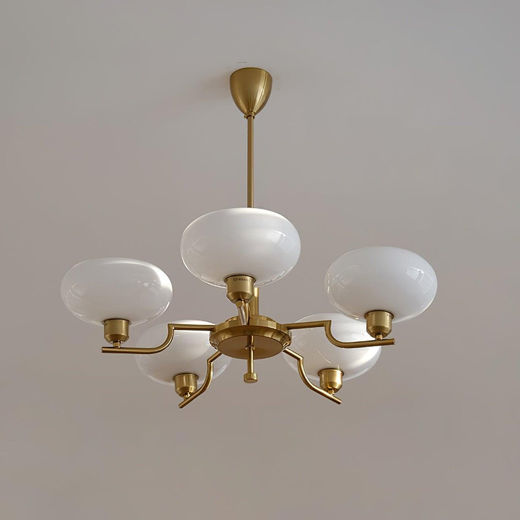 Clérachic five-head copper chandelier with one globe on the hub and four on stepped arms, white ceiling.