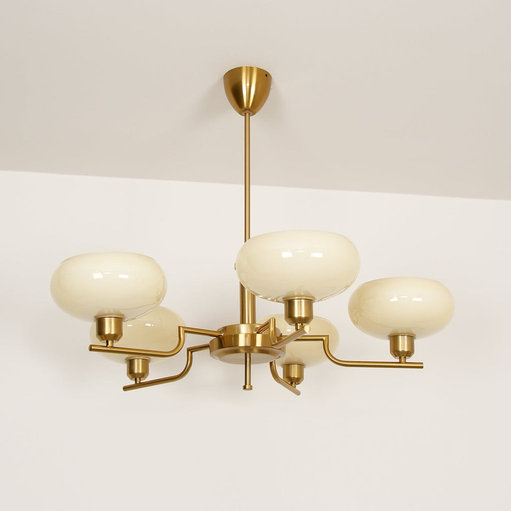 Clérachic five-head copper chandelier in cream glass, studio view of five upright globes on a pale backdrop.