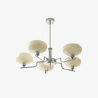 Clérachic five-head chrome chandelier in a three-quarter studio shot, cream globes on stepped chrome arms.