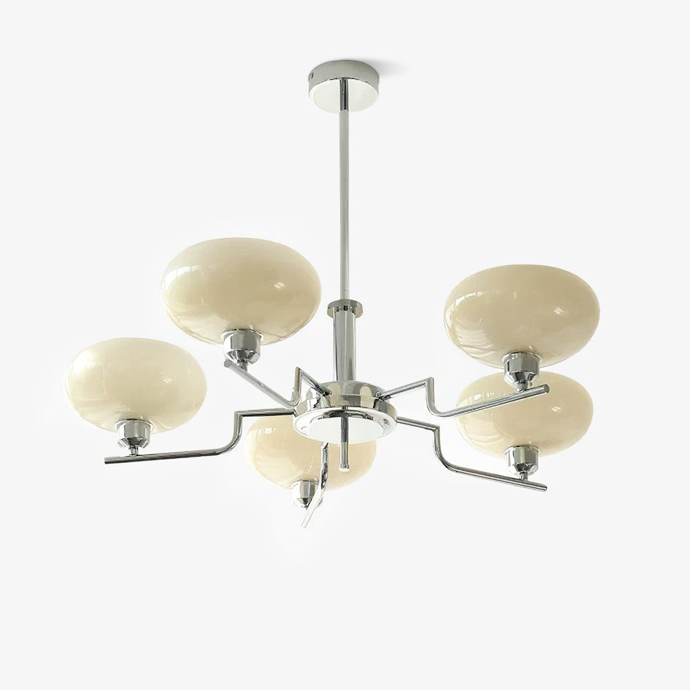 Clérachic five-head chrome chandelier from slightly below, five cream globes on a solid white backdrop.