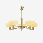 Clérachic five-head copper chandelier in a three-quarter studio shot, white globes on a light grey backdrop.