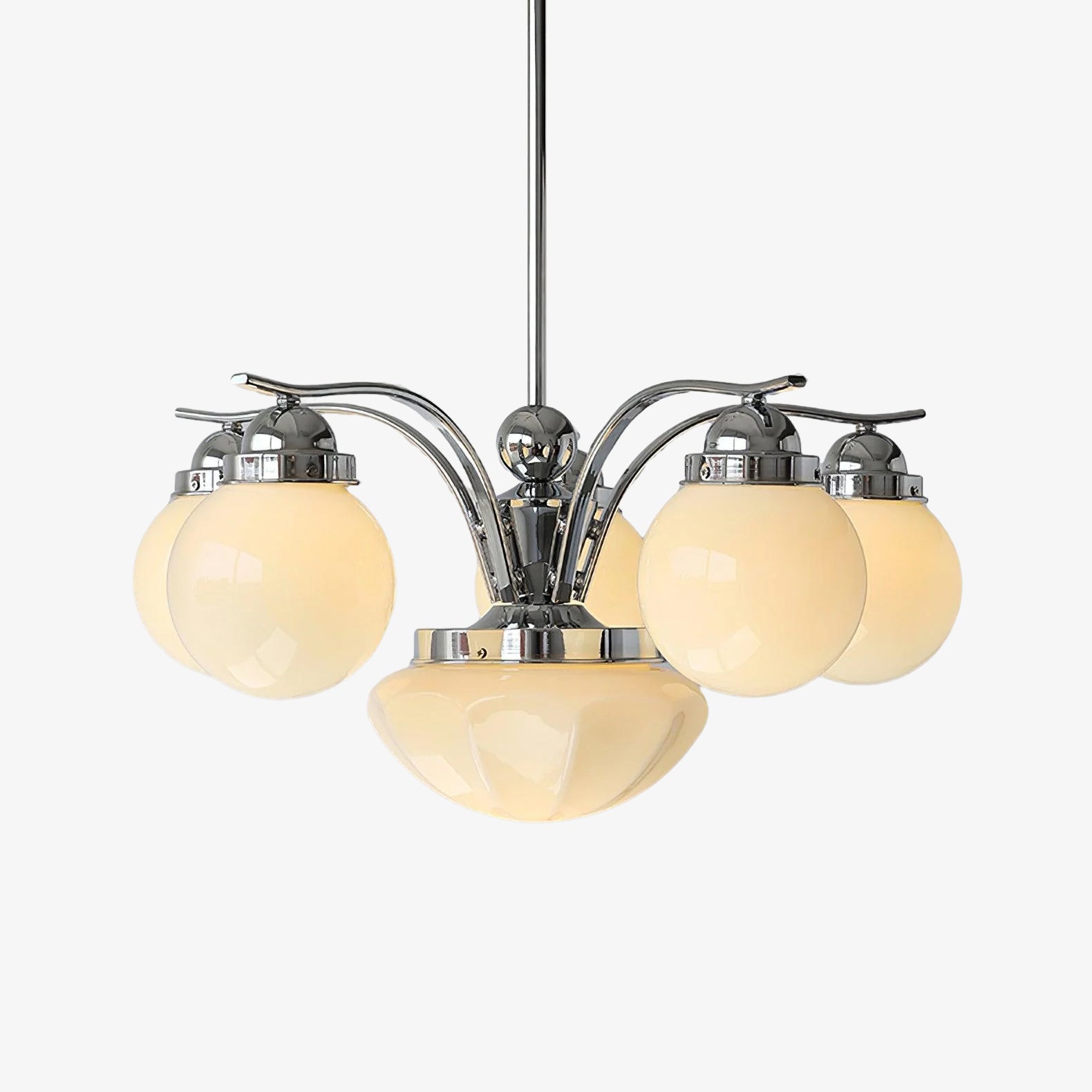 Clérachic glass globe chandelier in chrome, six cream globes plus a central bowl, softly glowing on a grey studio backdrop.