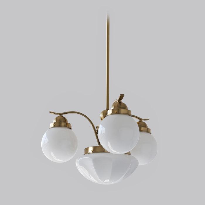 Clérachic copper-plated 4-light glass globe chandelier with white globes and a scalloped bowl on a grey backdrop.