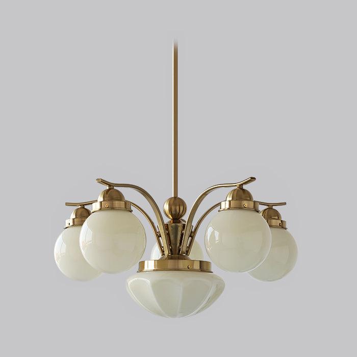Clérachic 6-light glass globe chandelier in copper-plated metal, five white globes and a ribbed bowl against grey.