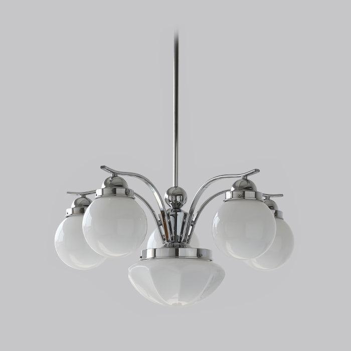 The Clérachic chrome 6-light glass globe chandelier fans white globes from a polished hub above its fluted bowl.