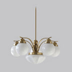 The Clérachic copper-plated glass globe chandelier, four lights, white globes and a bowl on a brushed copper stem.