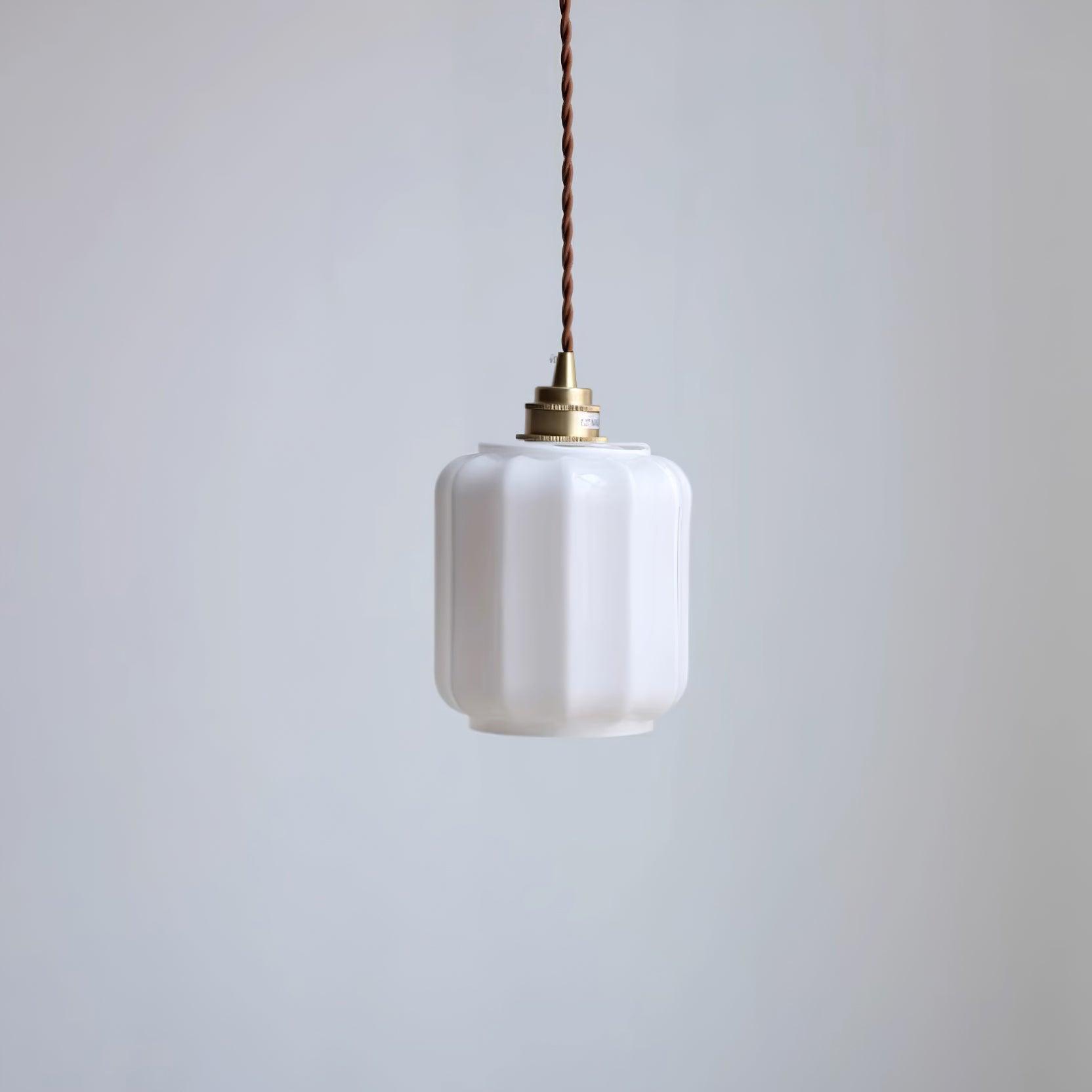 Clérachic glass globe pendant light in a front-facing unlit product shot with its full brass fitting and cord visible.