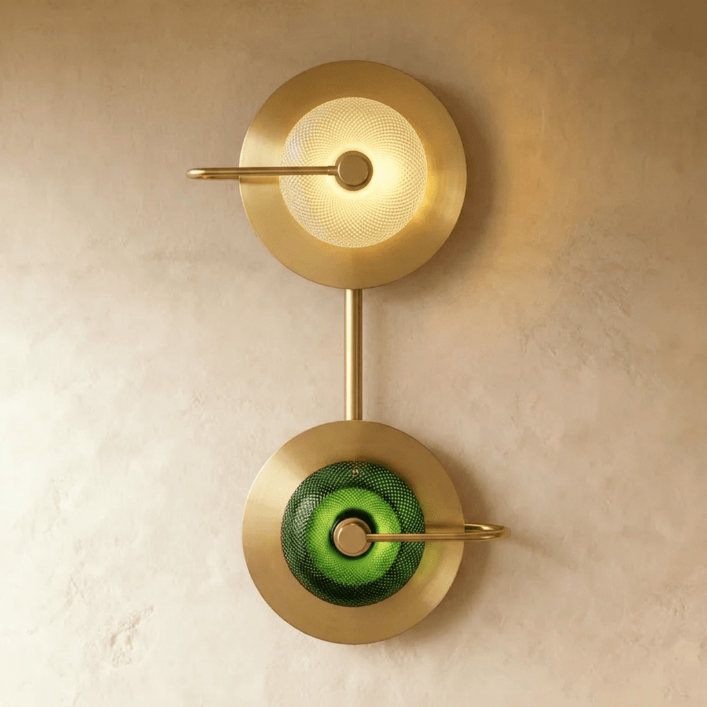 Clérachic two-head brass wall lamp stacking a clear textured glass dome above a green one, joined by a slim brass stem.