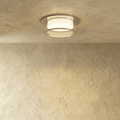 Clérachic ribbed-glass drum ceiling light in a silver finish, shown flush-mounted on a plaster ceiling, unlit.