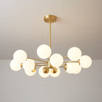Brass chandelier with lit frosted orbs on slender arms, a Clérachic light in a symmetrical, open layout.