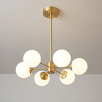 Smaller Clérachic chandelier with six lit white glass orbs around a brass hub, hung from a long rod.