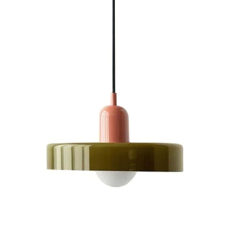 A Clérachic olive-green disc pendant with a pink cap, black cord and frosted globe, shown on a plain white backdrop.