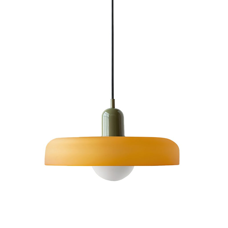 Orange disc pendant with a green cap and a black cord, over a round frosted globe, shown on white, from Clérachic.