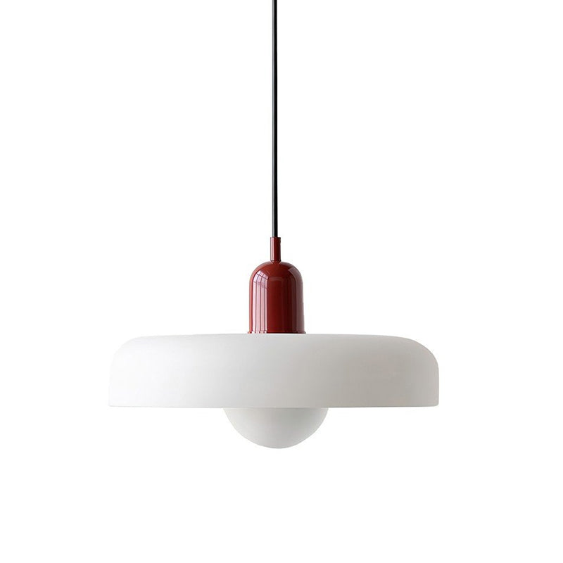 A white disc with a deep red cap and a black cord, frosted globe below, on a plain white backdrop, from Clérachic.