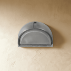 Clérachic half-dome aluminium outdoor wall lamp switched off, ribbed frosted glass under a brushed metal hood on a limewash wall.