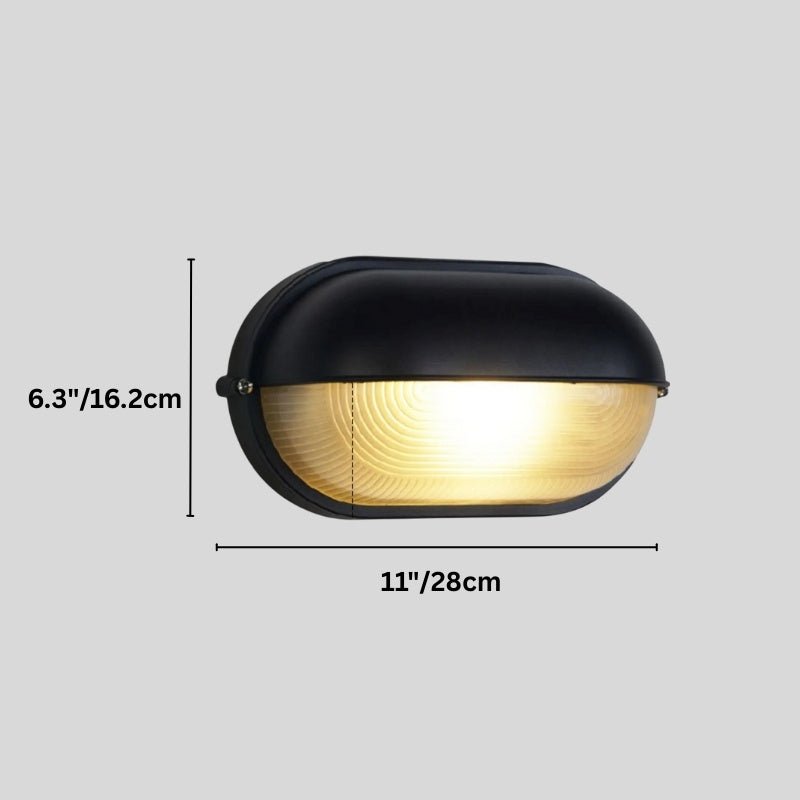 Clérachic black oval wall lamp with hooded cap on a grey backdrop, with its height and width dimensioned in cm and inches.