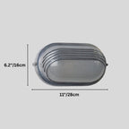 Clérachic louvred oval wall lamp in grey metal with a frosted lens, on a plain grey backdrop with height and width marked.