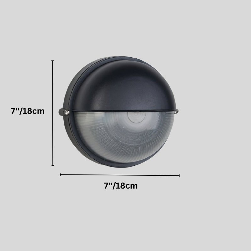 Clérachic round black wall lamp with a domed hood and ribbed glass, on a grey backdrop with its 18 cm diameter marked.