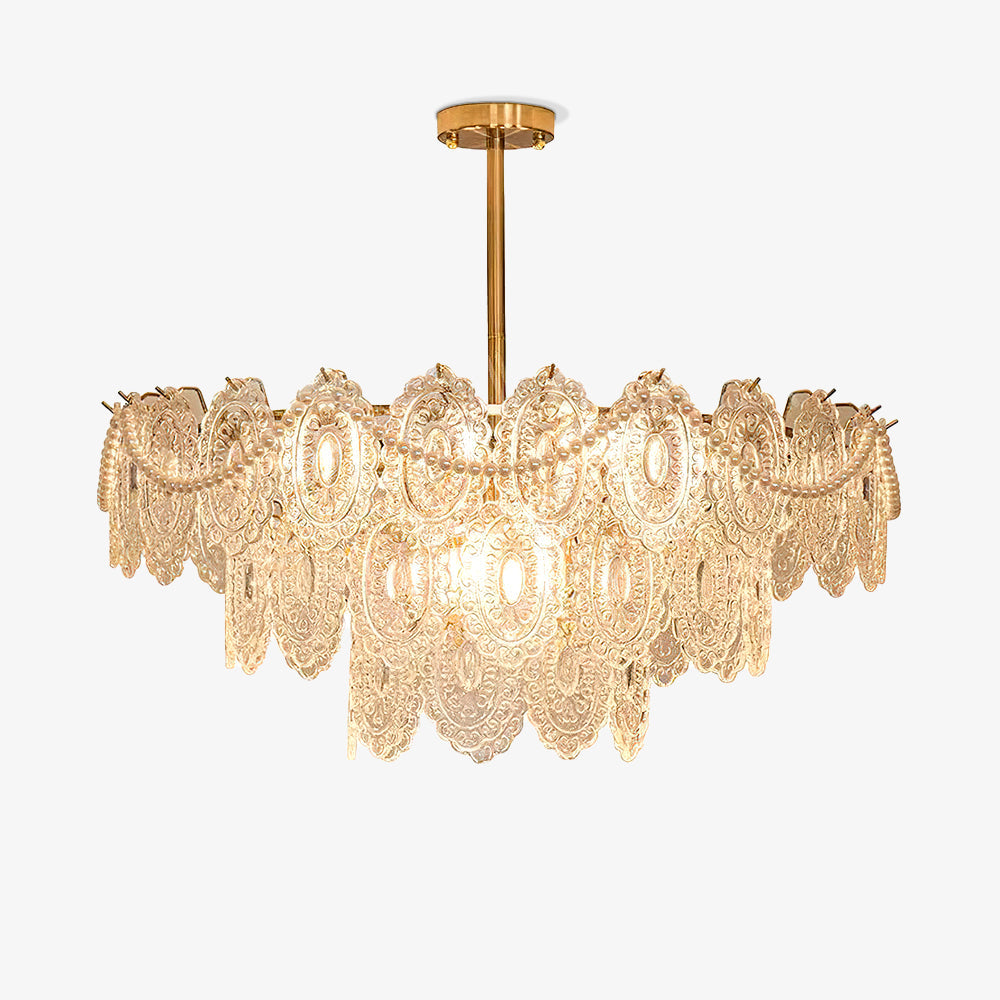 Tiered Clérachic chandelier with embossed clear glass panels, looped pearl strands and a gold rod, on a plain white background.