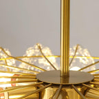 Close view of the gold canopy plate and ribbed metal frame where the rod meets the top of this Clérachic chandelier.