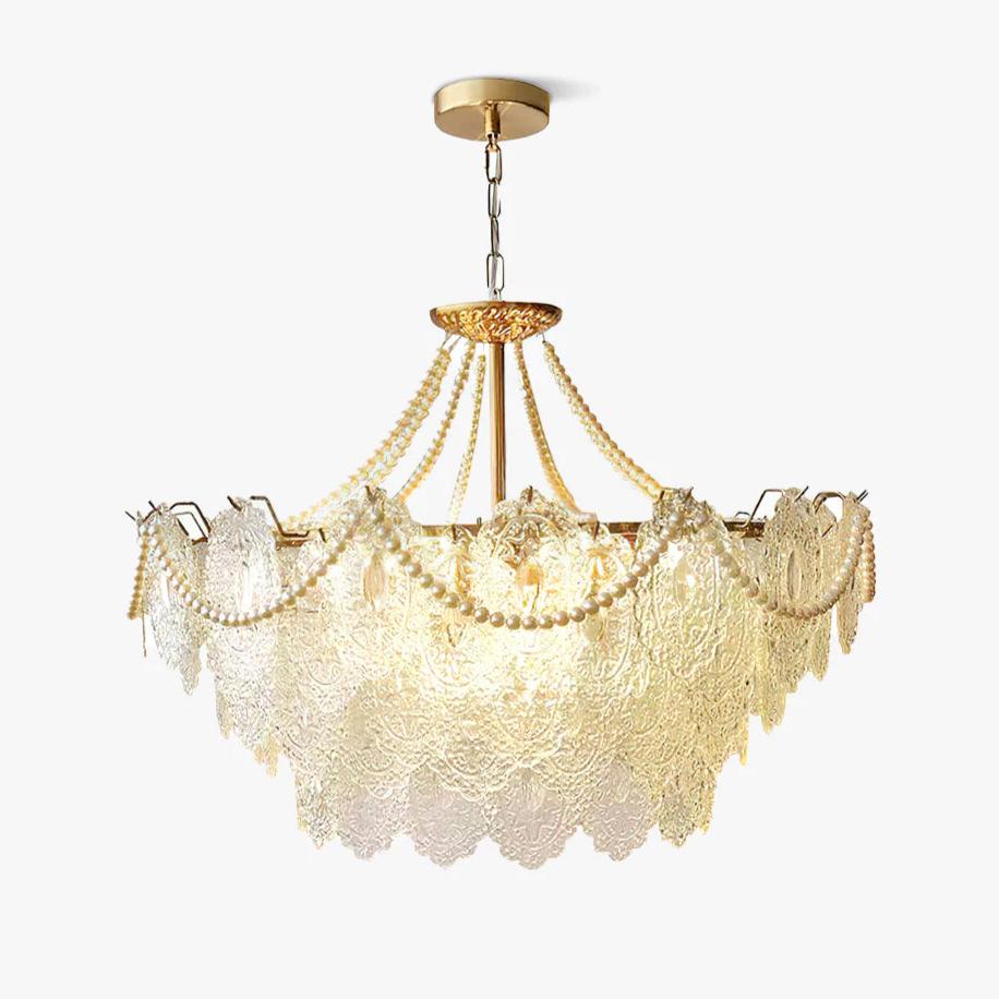 Embossed clear glass panels and swags of pearl strands on a gold frame hanging from a chain, this Clérachic pendant light on white.