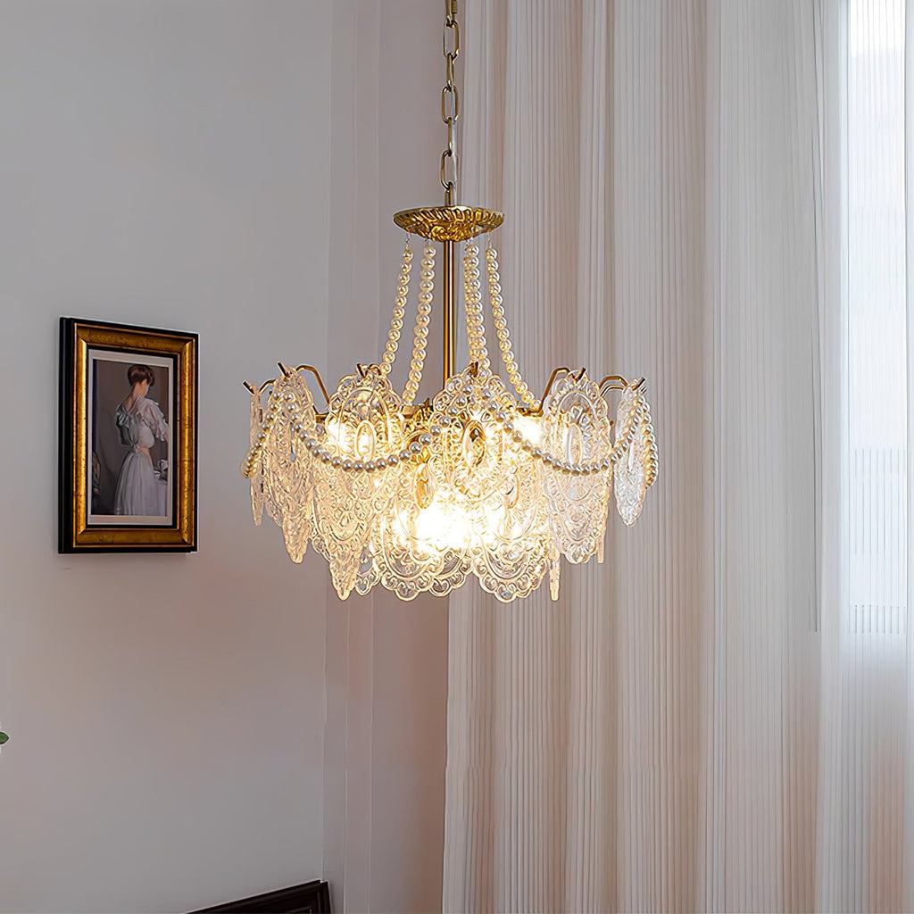 Clérachic pendant lit beside a framed portrait and a floor-length curtain, with a gold canopy, pearl swags and embossed glass panels.