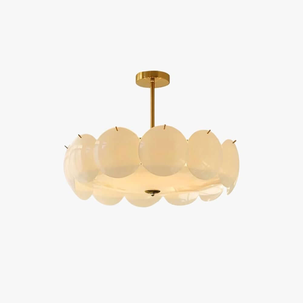 Round pendant of overlapping white glass discs on a brass stem and canopy, lit warm, on a plain white backdrop, from Clérachic.