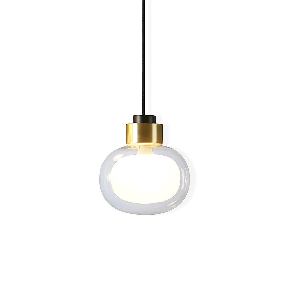 Clear glass pendant with a brass-toned collar and a glowing white inner globe, on a plain white backdrop, from Clérachic.