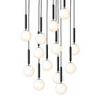 A tall cascade of Clérachic pendants with white opal globes on black rods, glowing warm on a white background.