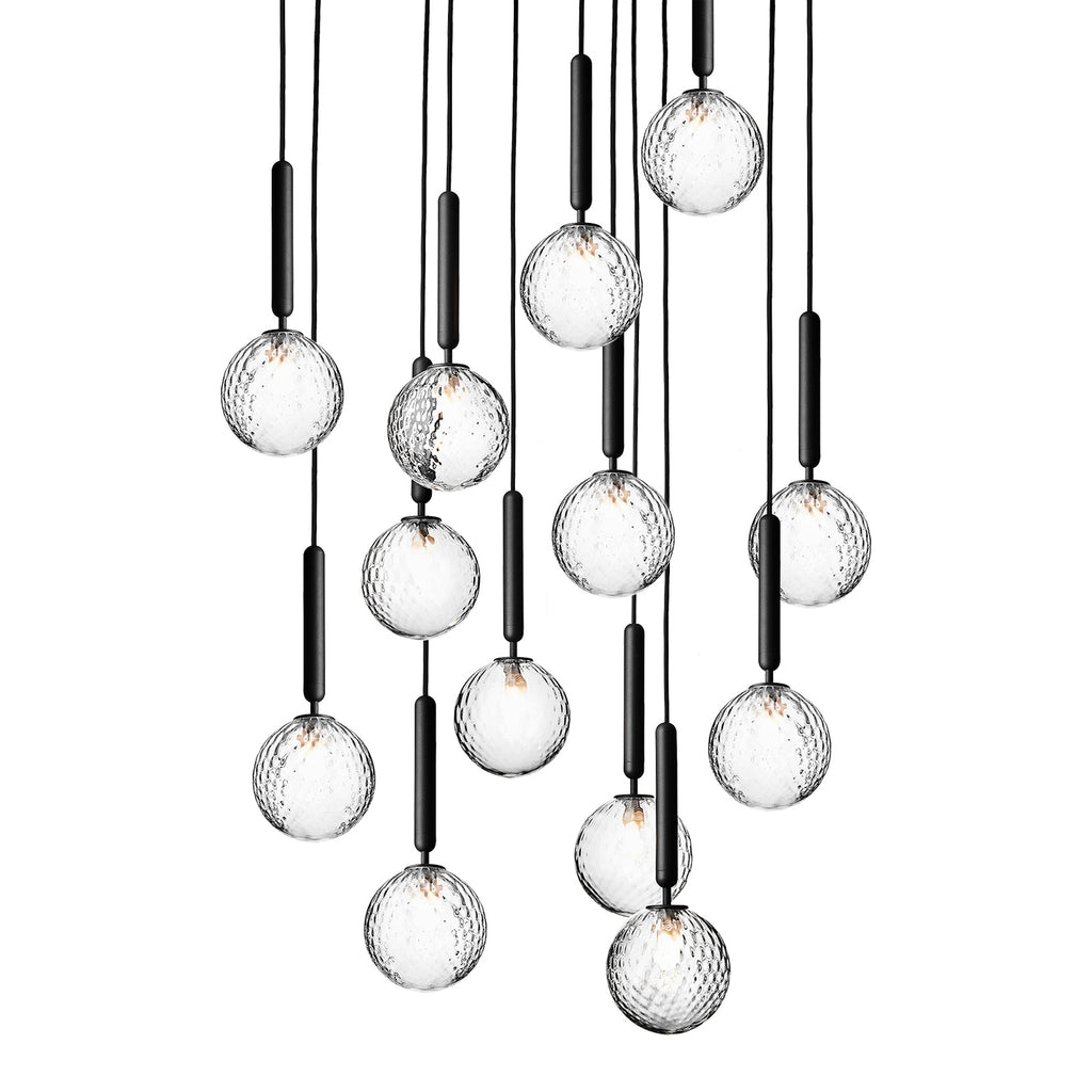 A tall cascade of Clérachic pendants with clear textured globes on black rods, shown against white.