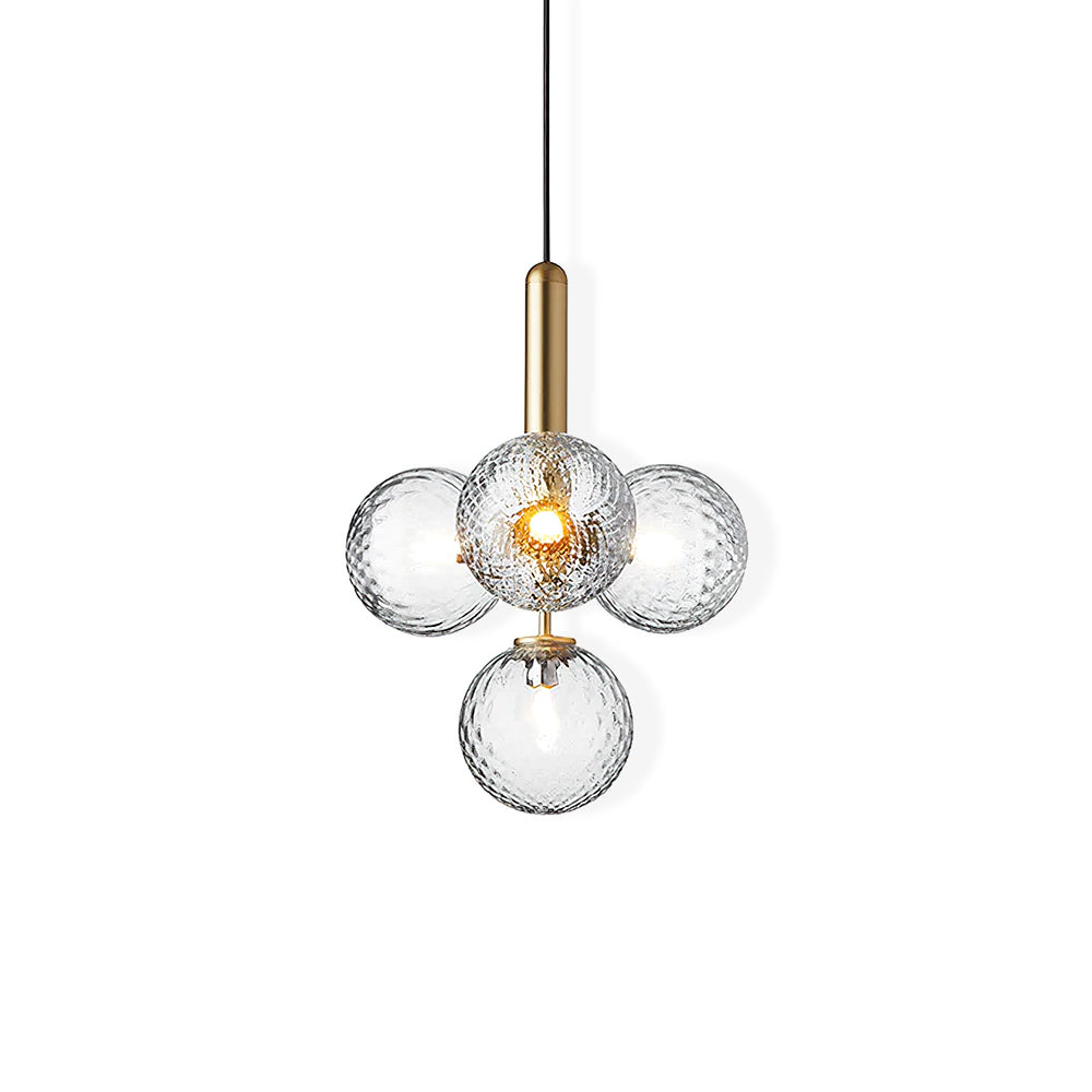 Clérachic four-globe pendant in clear textured glass with a brass rod, cut out on a white background.