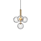 Clérachic pendant with four clear textured globes and a brass rod, centred on a plain white backdrop.