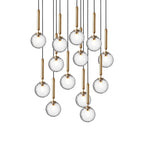 A tall group of Clérachic pendants with clear glass globes on brass rods, shown unlit on a white background.