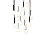 A large cluster of Clérachic pendants with white opal globes on black rods, shown lit on a white background.