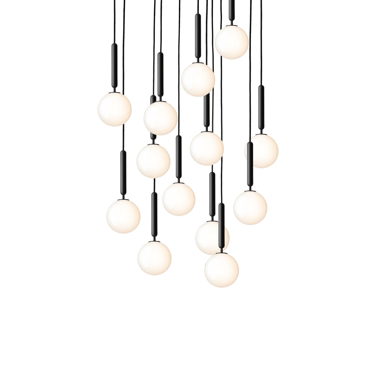 A large cluster of Clérachic pendants with white opal globes on black rods, shown lit on a white background.