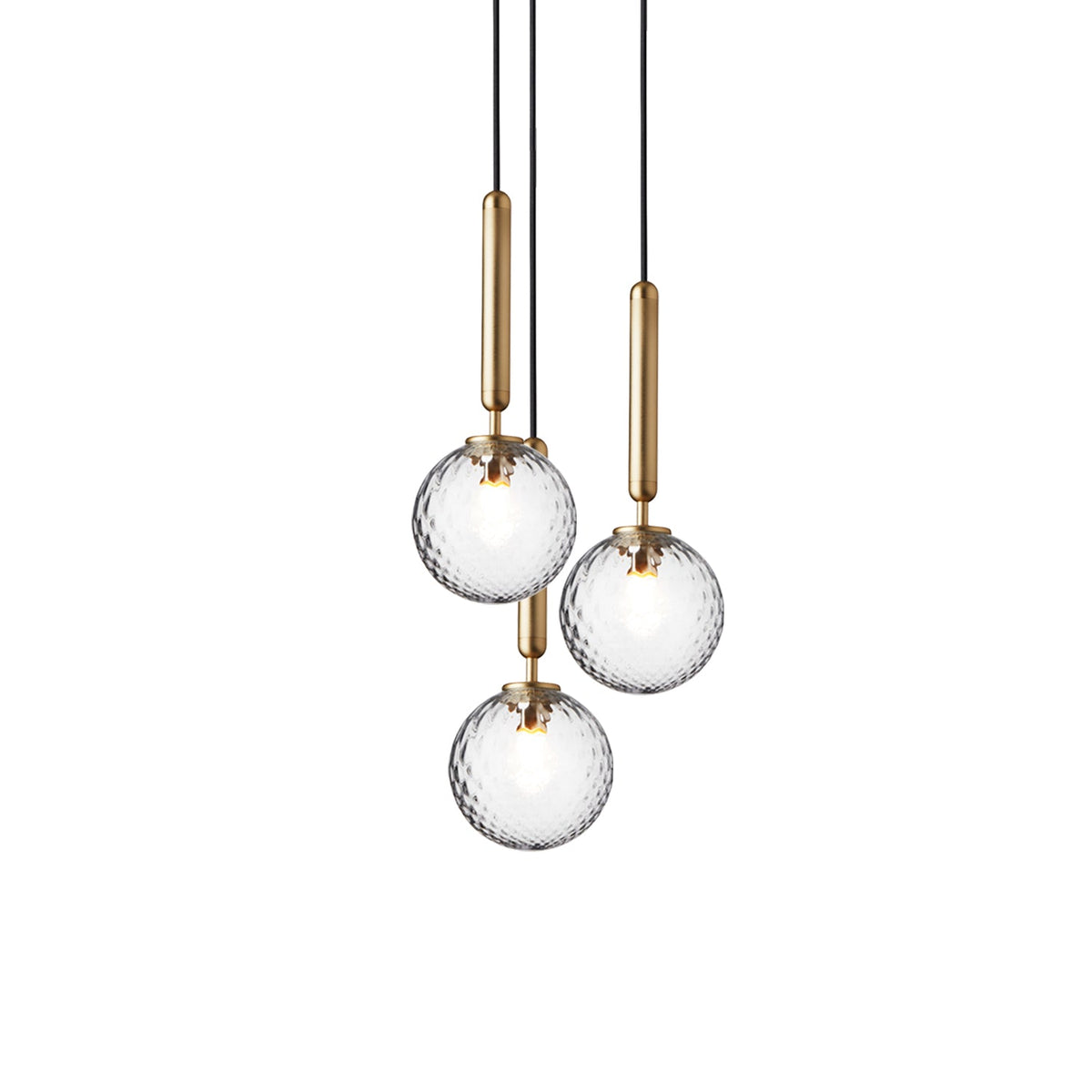 Three Clérachic pendants with clear textured globes on brass rods, hung close together on a white background.