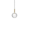 Clérachic pendant with a single clear textured globe and a brass rod, cut out on white.
