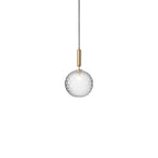 Clérachic pendant with a single clear textured globe and a brass rod, cut out on white.
