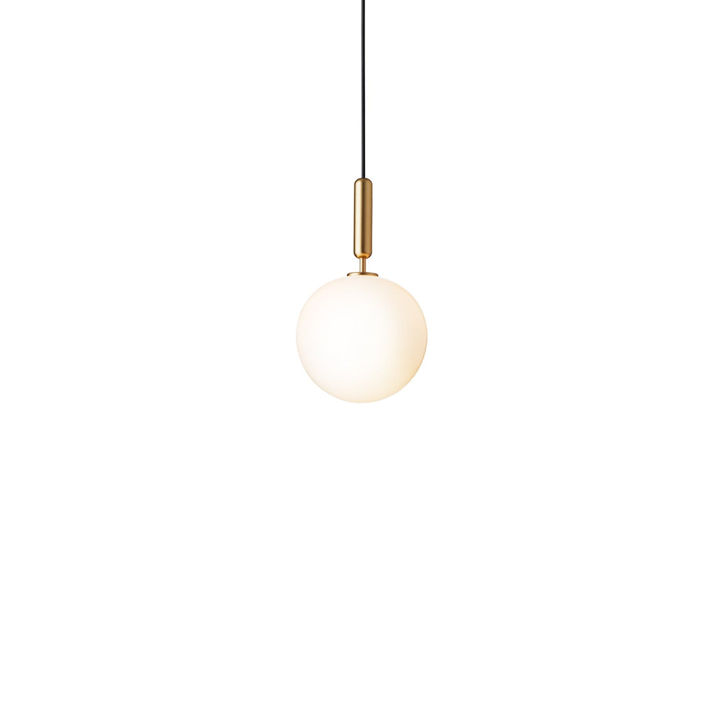 Clérachic pendant with a single white opal globe and a brass rod, lit warm on a plain white background.