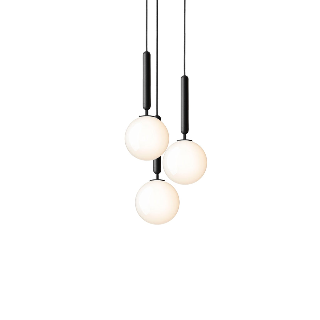 Clérachic pendant trio with white opal globes on black rods, hung closely together on a white background.