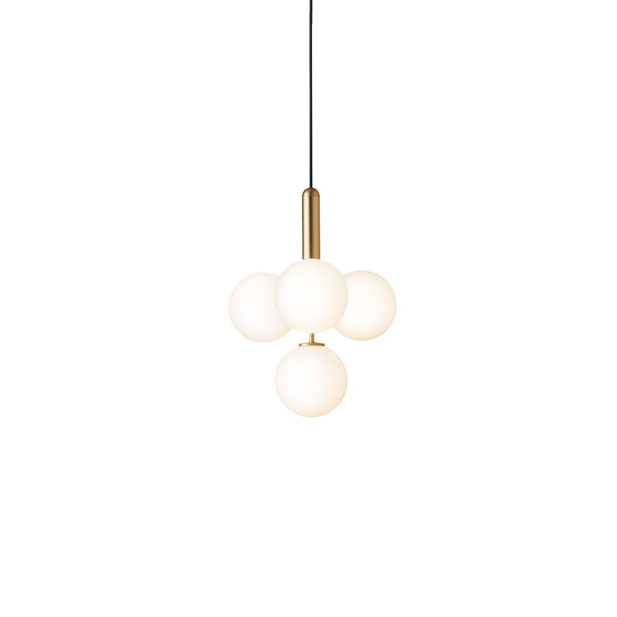 Clérachic four-globe cluster pendant with white opal globes on a brass rod, lit warm on white.