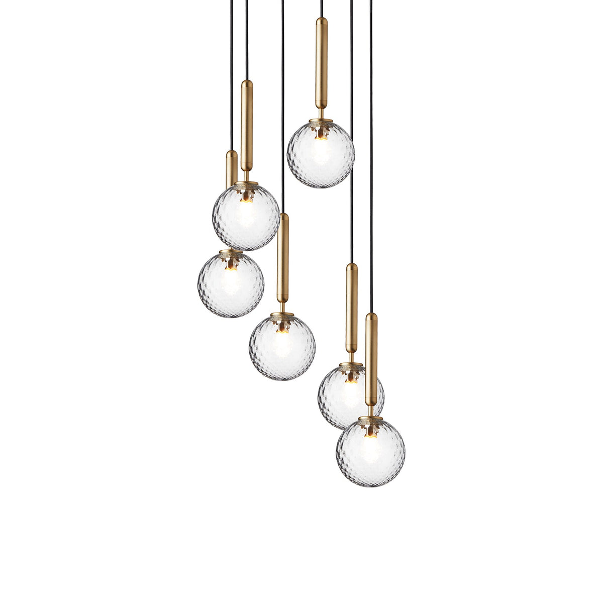 Eight Clérachic pendants with clear textured globes on brass rods hang at varied heights on a white background.