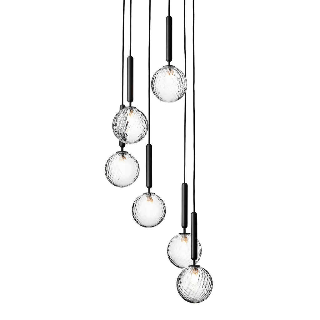 Clérachic cluster pendants with clear textured globes and black rods, shown unlit on a plain white backdrop.