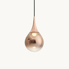 Teardrop glass shade with a rose gold fitting on a black cord, this Clérachic pendant shown against a plain off-white backdrop.
