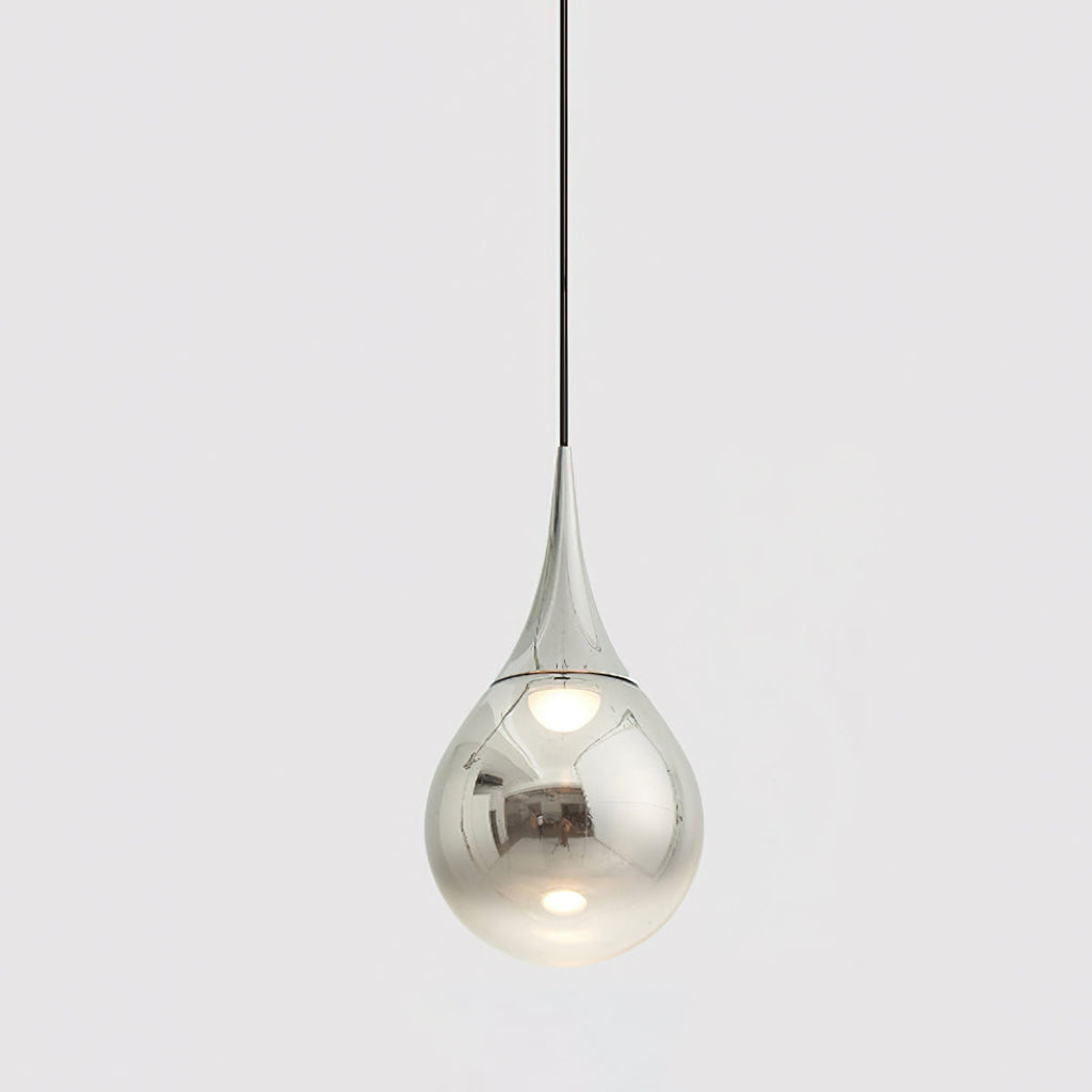 Chrome-finish Clérachic pendant with a mirrored teardrop shade, hanging from a black cord against a pale grey backdrop.