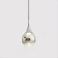 Chrome-finish Clérachic pendant with a mirrored shade and a warm bulb visible within, on a light grey backdrop.