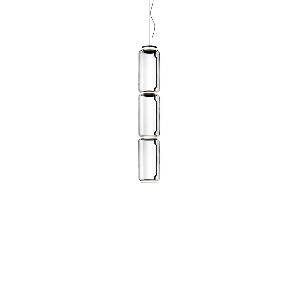 Three stacked glass cylinders hanging from a thin cable, this Clérachic pendant on a plain white backdrop.